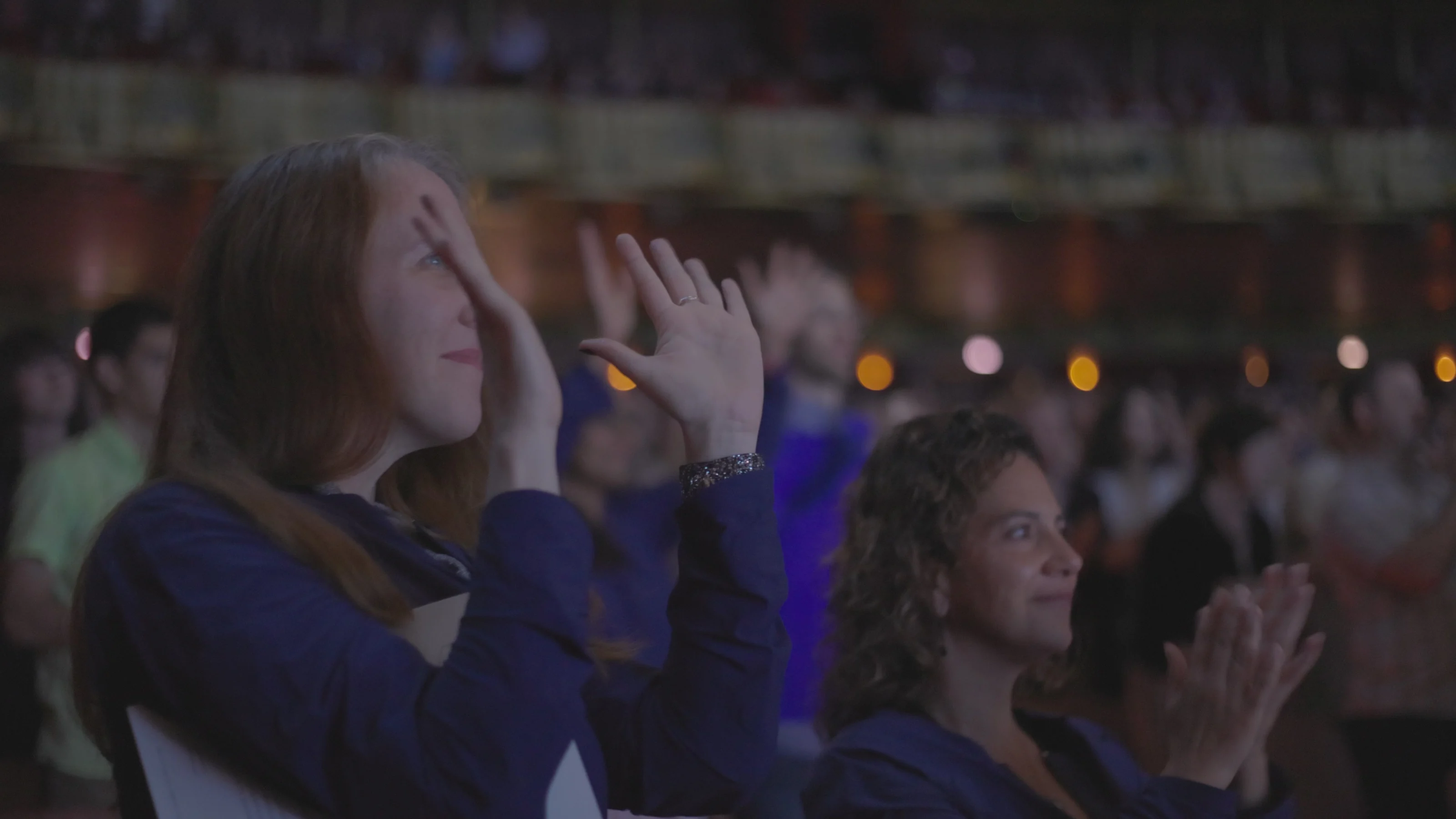Audience experiencing a live performance wearing SoundShirts