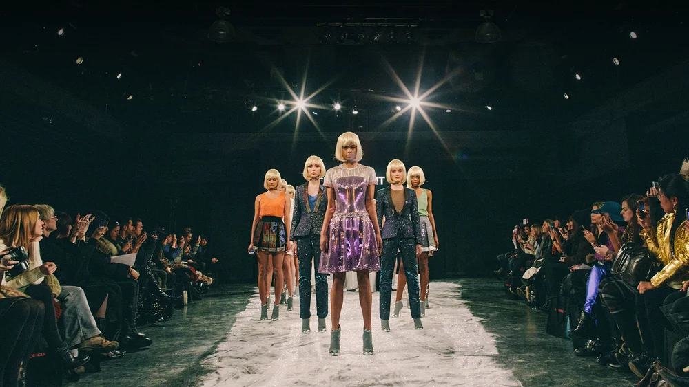 Models on the runway wearing a CuteCircuit collection