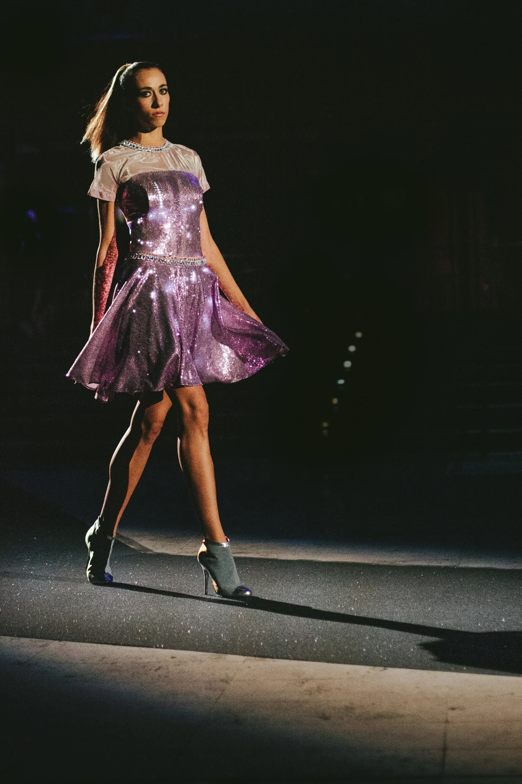 Illuminated purple dress on the Rome anniversary runway