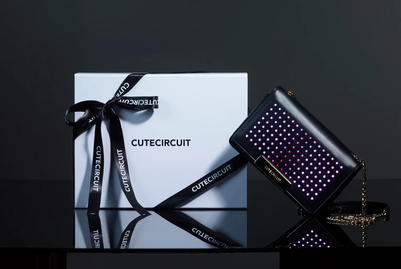 CuteCircuit’s illuminated leather handbag, photographed with CuteCircuit packaging