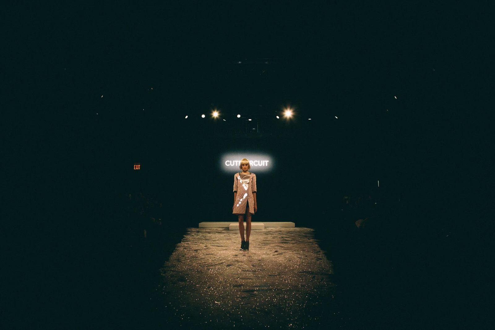 Model centered on the illuminated CuteCircuit New York Fashion Week runway