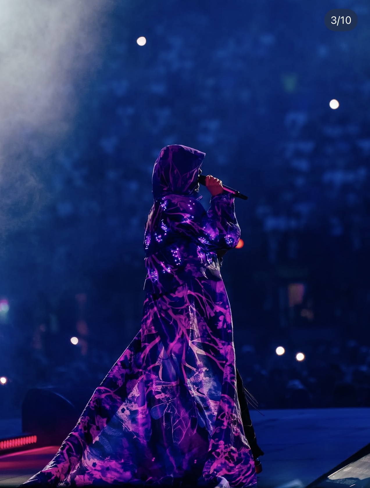Full-length view of Elisa’s luminous parka and flowing train