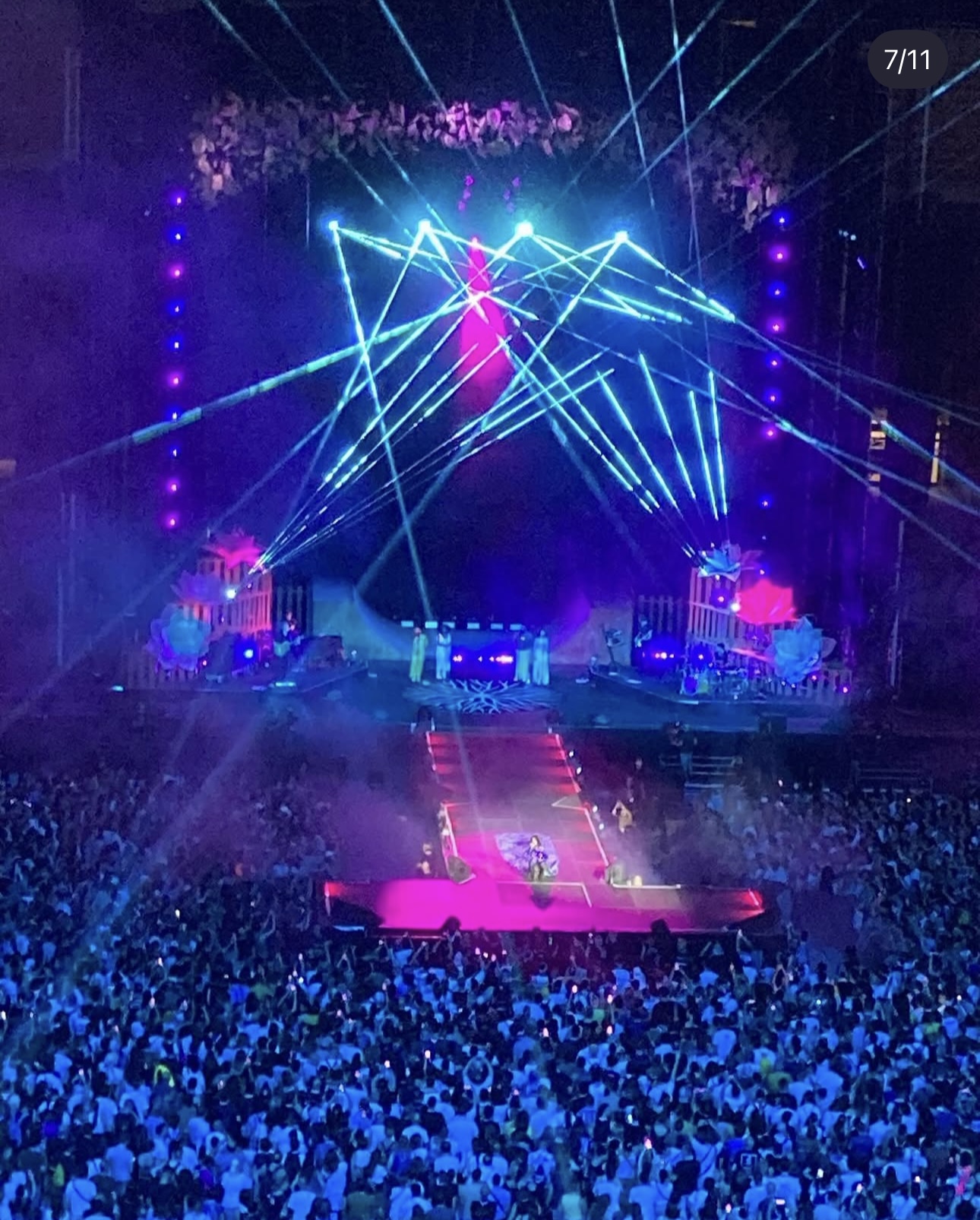 Elisa performing in the illuminated parka in front of the San Siro crowd